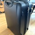 Daruji lehce poškozený cestovní kufr