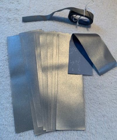 Reflexní stříbrné pásky k našití na oděvy, tašky, apod.