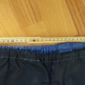 Šusťákové kalhoty s kapsou vel. cca 140-152