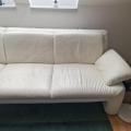 L shaped white leather couch