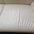 L shaped white leather couch