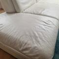 L shaped white leather couch