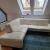 L shaped white leather couch