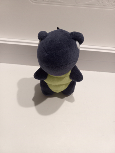 Modrý plyšový dinosaurus