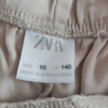 Béžové kalhoty Zara vel.140