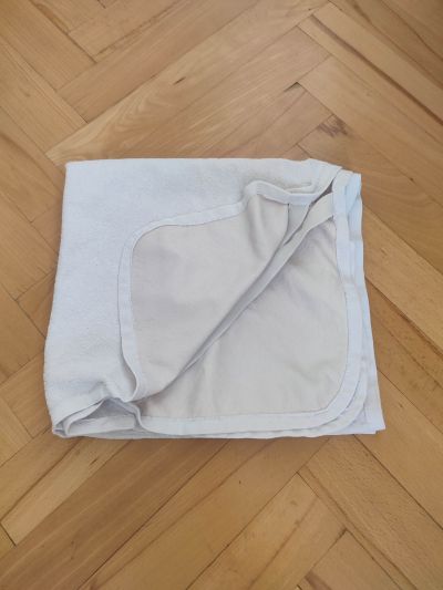 Nepromokavá podložka do dětské postýlky