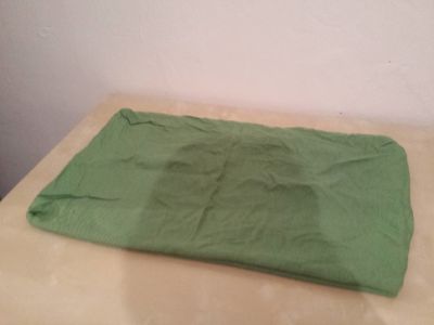 Zelený povlak na polštář